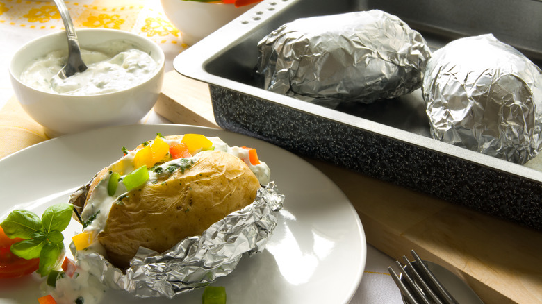 Baked potatoes wrapped in foil