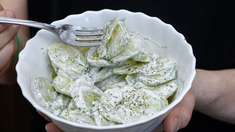 Cucumber salad with a creamy dressing and herbs