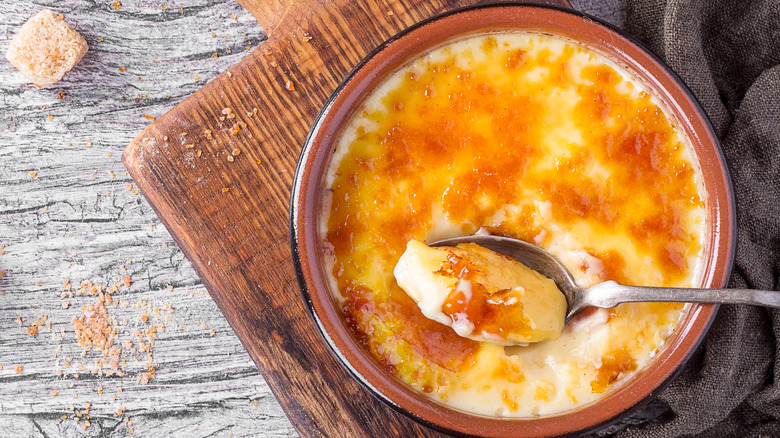 creme brulee eaten with spoon