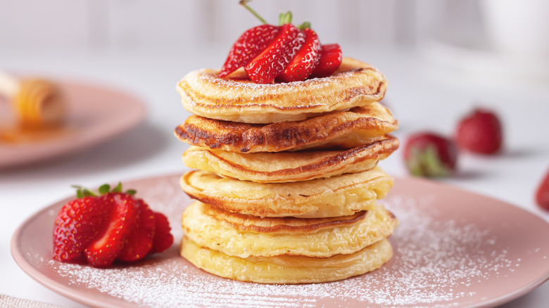 fluffy pancake stack with strawberries