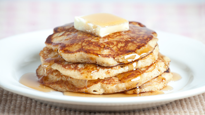 fluffy pancakes drizzled with syrup