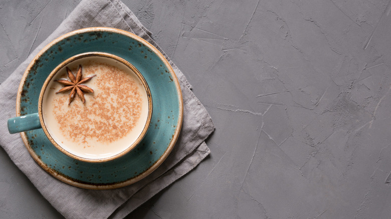 Chai tea latte on a blue saucer plate