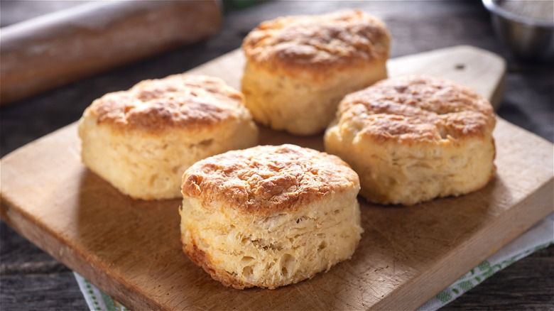 Biscuits on wooden cutting board 