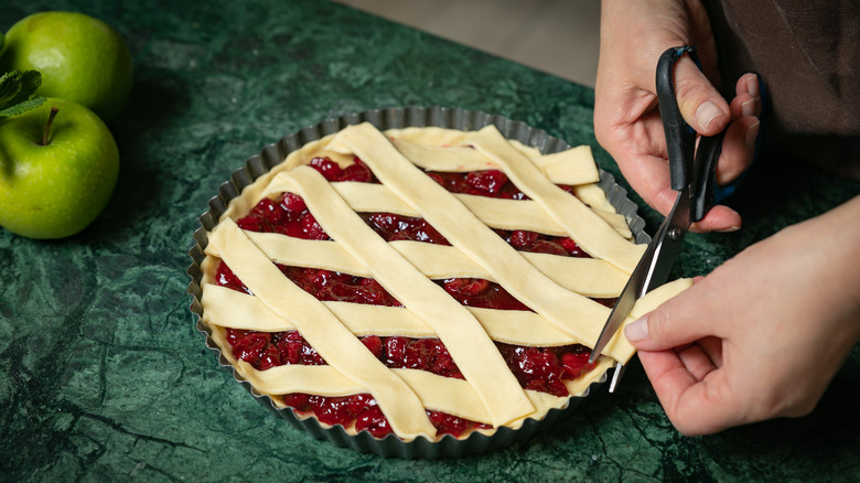 Baker making cherry pie