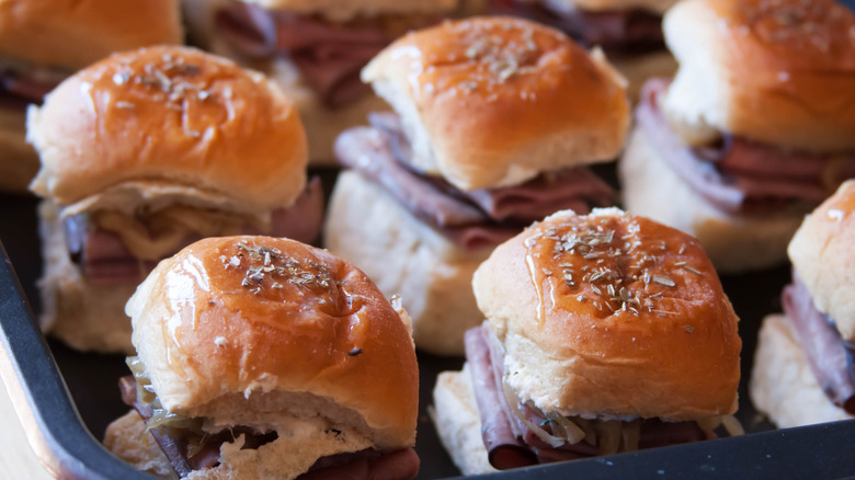 Hawaiian roll sliders with butter and herbs on top