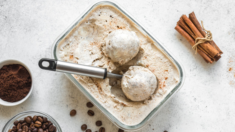 container of coffee cinnamon ice cream with scooper