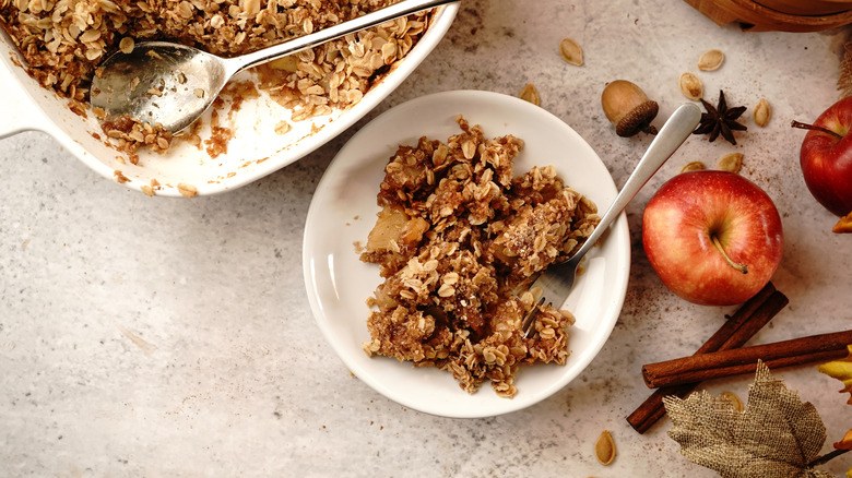 Homemade apple crisp on a plate and in a casserole dish