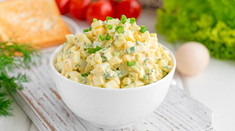 Bowl of egg salad with green onions