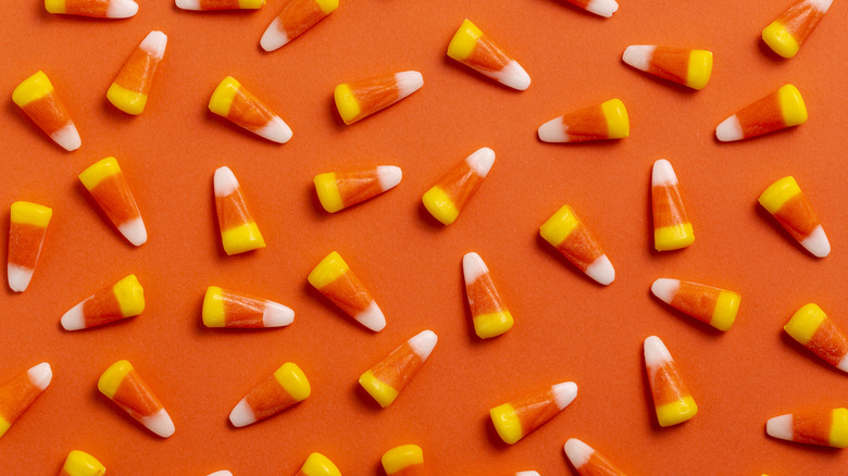 candy corn on orange background