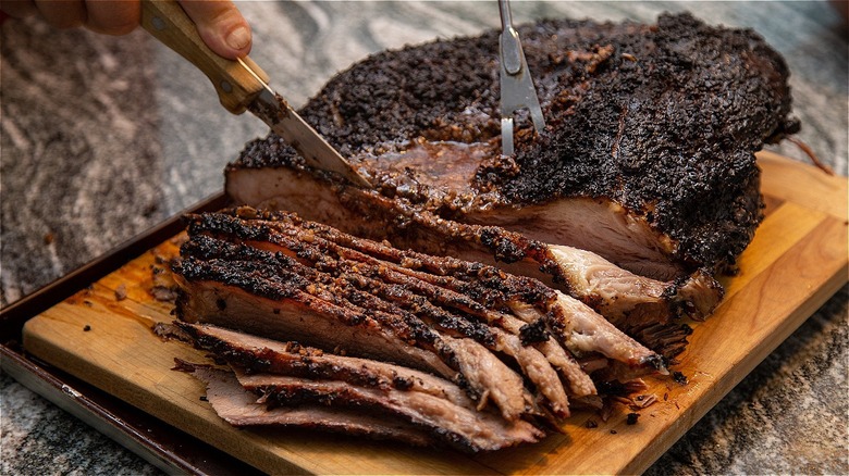 slicing smoked brisket for serving