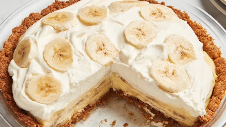 Banana cream pie with a slice removed