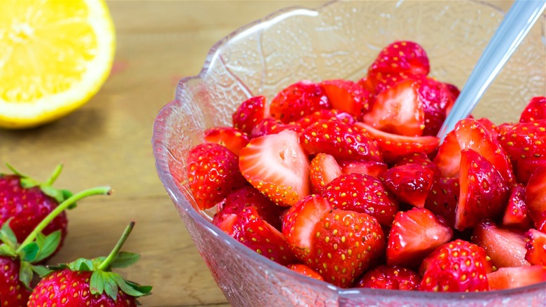 Chopped strawberries in glass bowl 