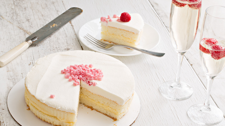 Cake next to Champagne flutes