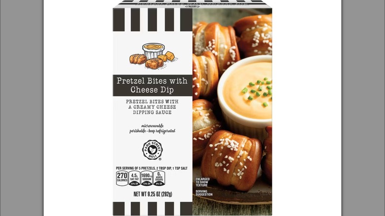 Box of pretzel bites with cheese dip from Aldi against white background.