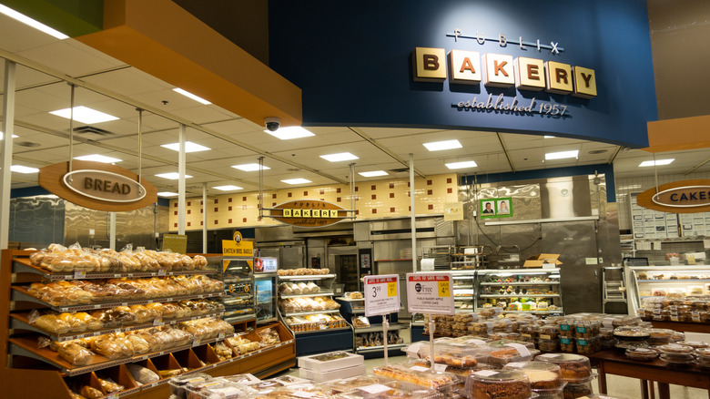 Publix bakery with baked goods and signs for bread, and cakes
