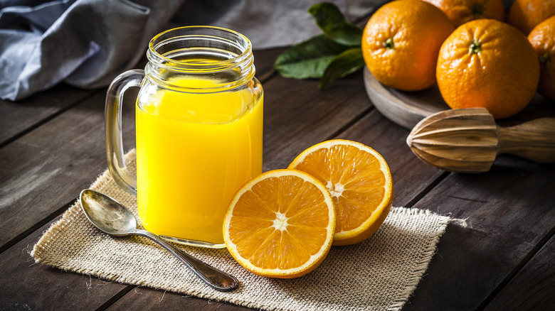 orange juice glass with fruit