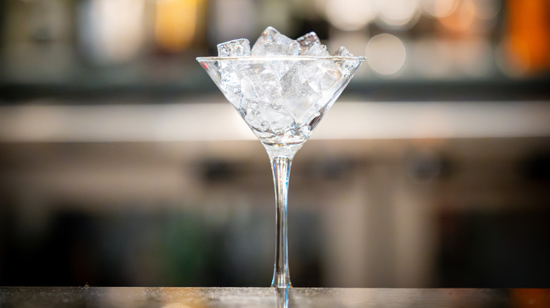 Martini glass filled with ice cubes