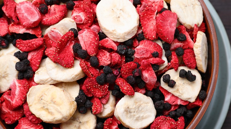 Bowl of dried fruits including bananas and strawberries