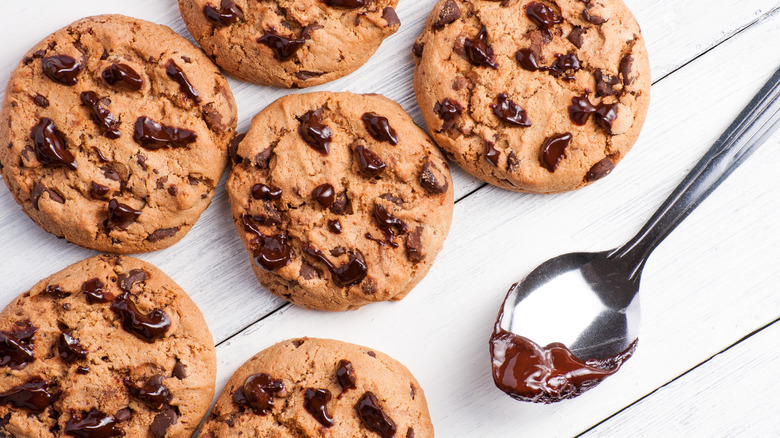 Nutella chocolate chip cookies on wood surface