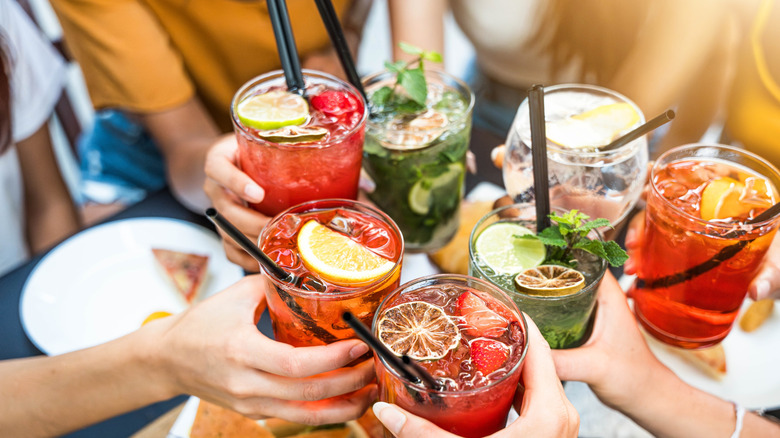 Friends sharing cocktails