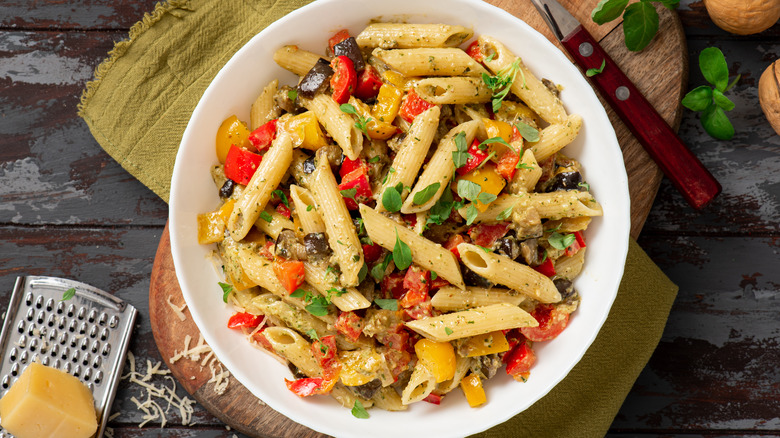 pasta salad with peppers served in white bowl