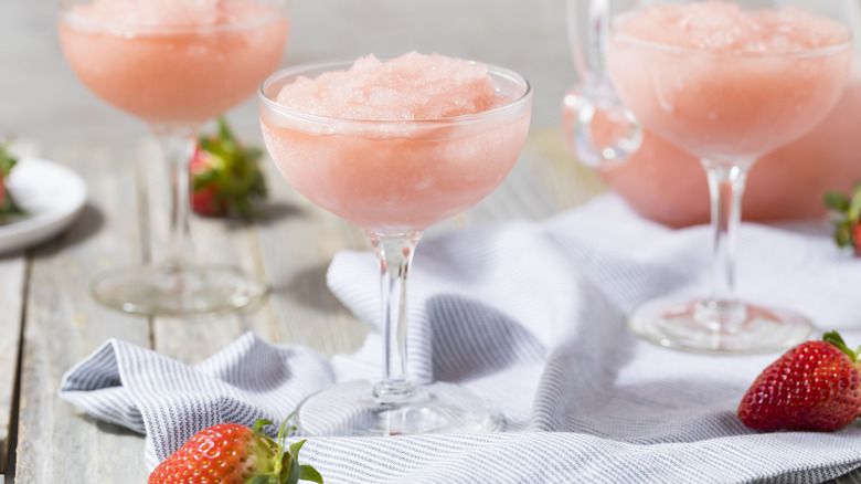 frozen pink cocktails next to strawberries