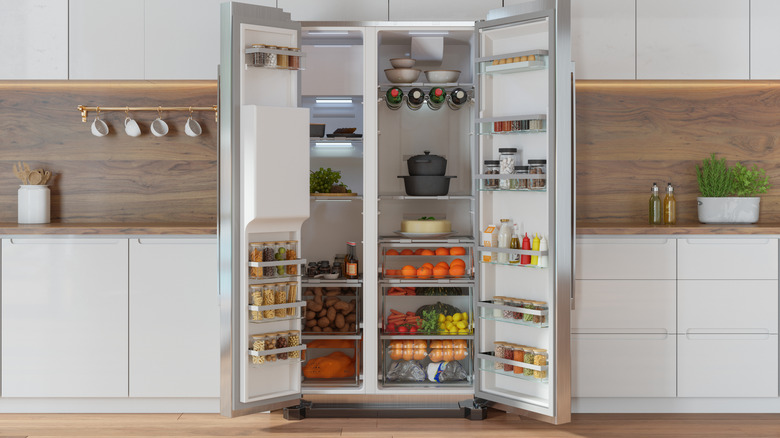 Refrigerator doors open in a kitchen