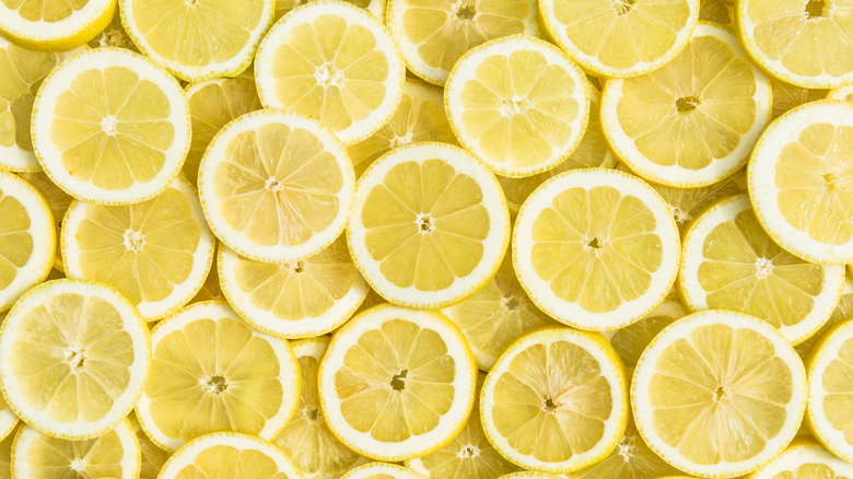 Lemon slices spread on surface