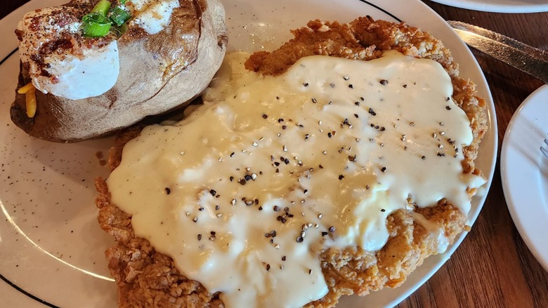 Saltgrass Steakhouse country fried steak, served with a baked potato