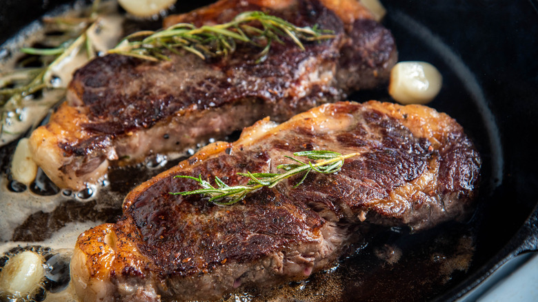 Close up of a steak in a pan
