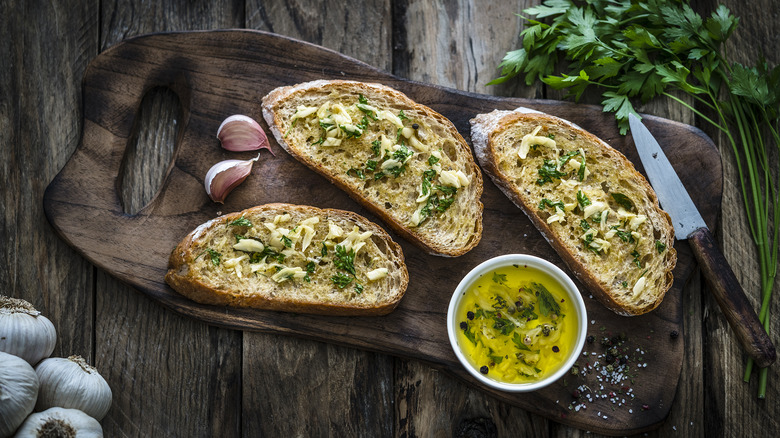 Garlic bread on wooden board