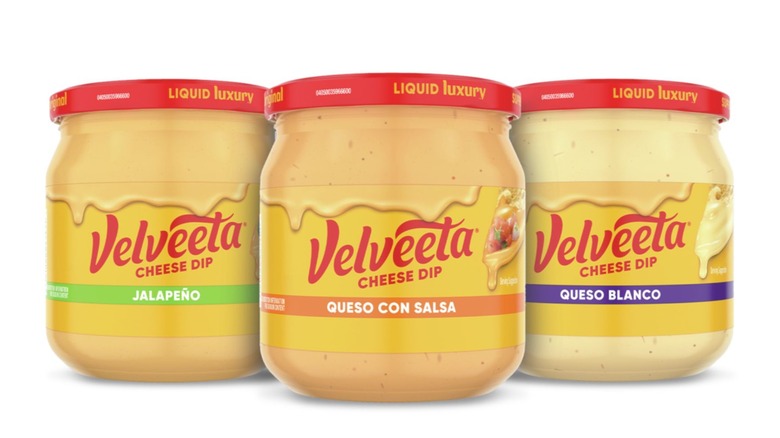 three jars of velveeta queso