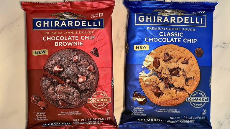 Two Ghirardelli cookie dough packages on marble surface