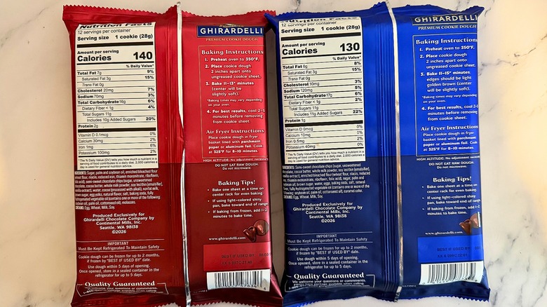 Back of two Ghirardelli cookie dough packages on marble surface