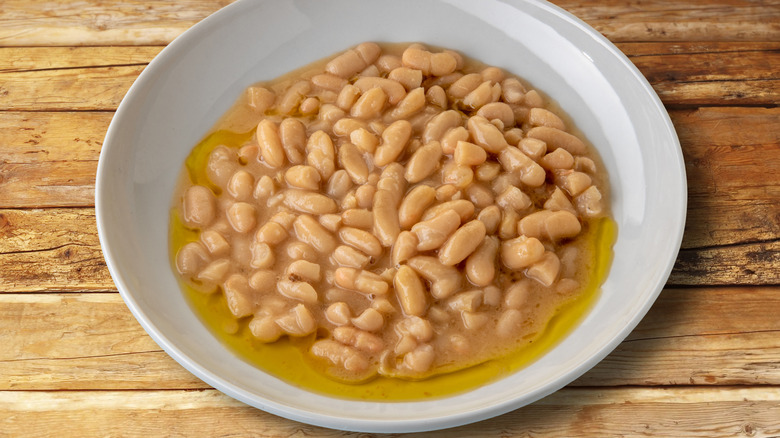 Cannellini beans in a white bowl on a table