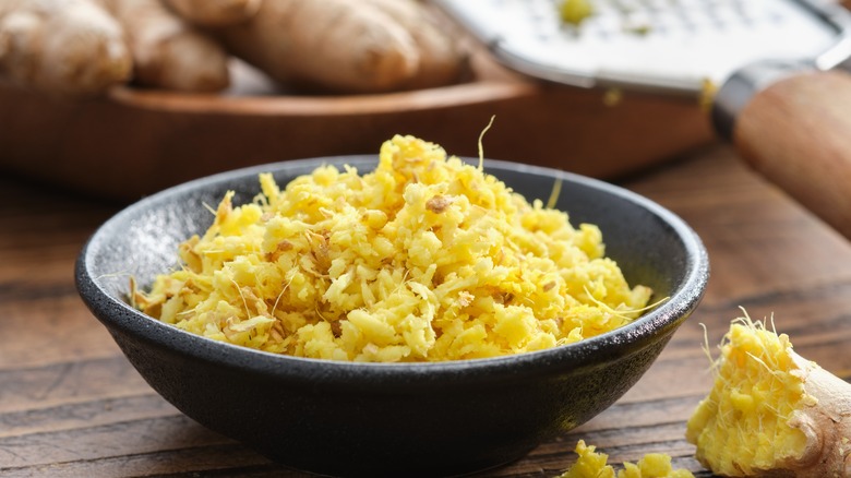 bowl of grated ginger on table