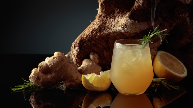 Ginger drink surrounded by roots