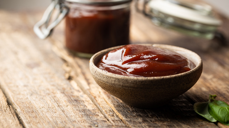 bowl of barbeque sauce with jar