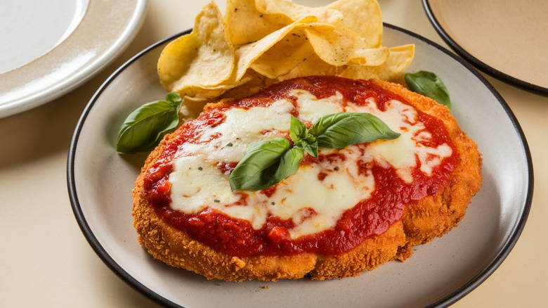 chicken parmigiana dish with pizza sauce and mozzarella cheese