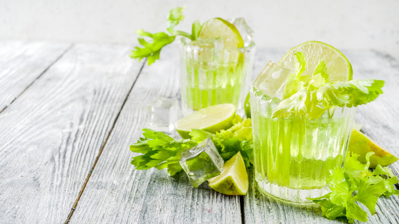 glasses with celery leaves and lime