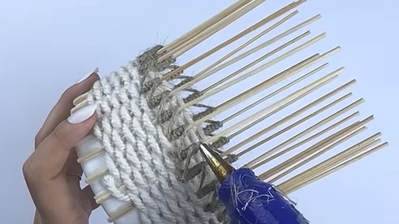 A weaved basket made with a plastic lid