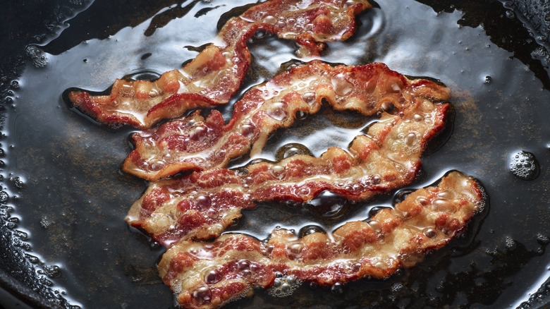 Bacon frying in a pan