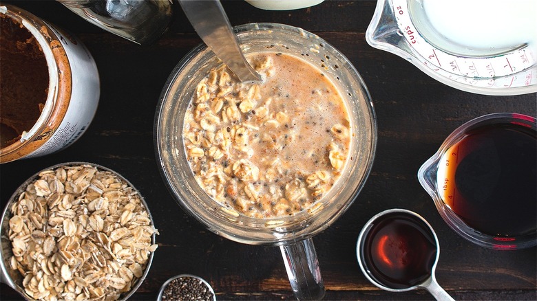 Mixing overnight oats in glass jar 