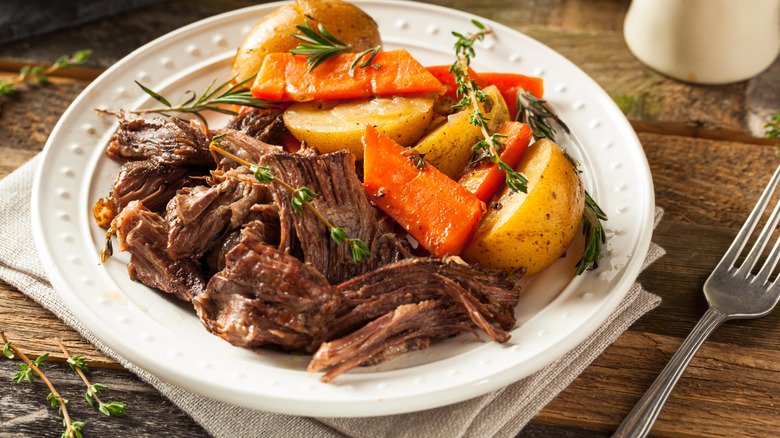 Pot roast on a plate on a table