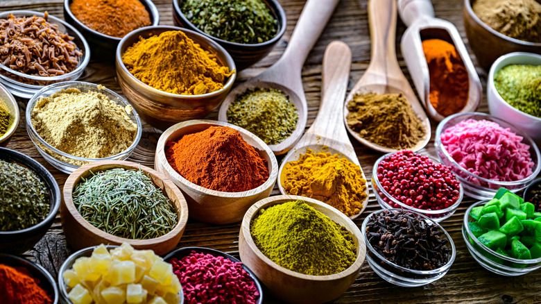 A collection of dried spices in various containers