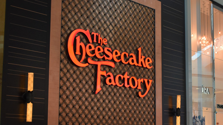 Sign for The Cheesecake Factory with orange text