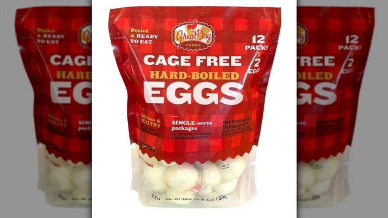 Hard boiled eggs in a red plaid bag on white background