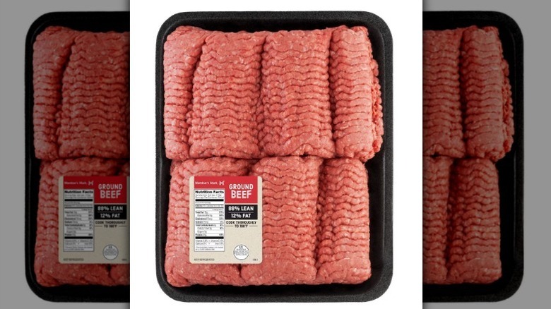 A package of ground beef in a black tray on a white background