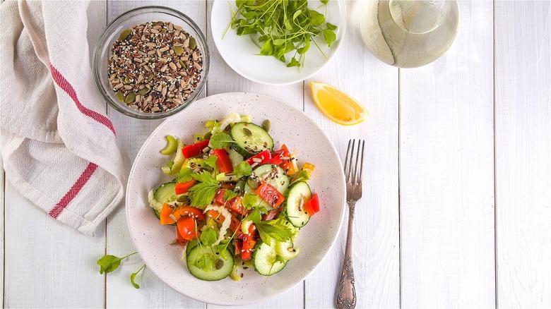 Salad and a bowl of seeds 