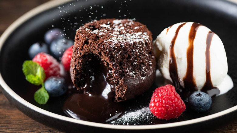 Chocolate fondant cake with fresh berries and ice cream